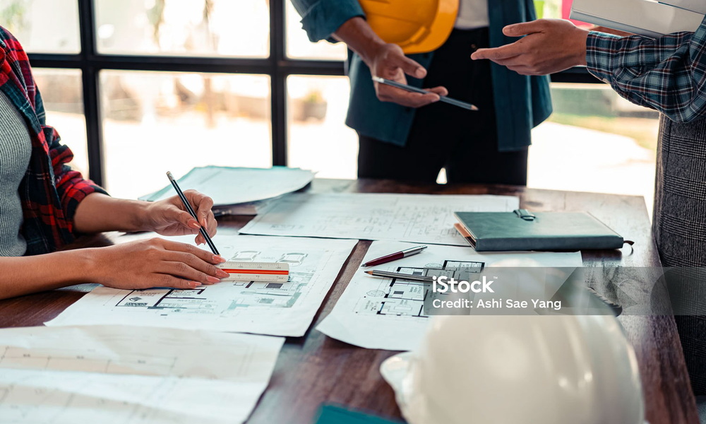 Reviewing plans at a desk